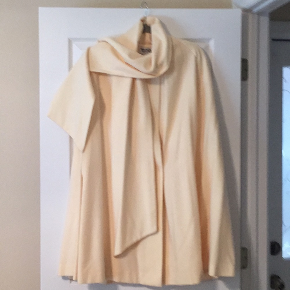 Off white cape style coat.
